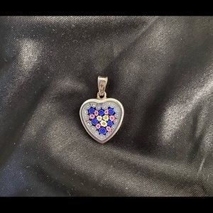 Sterling silver glass flower design heart pendant.